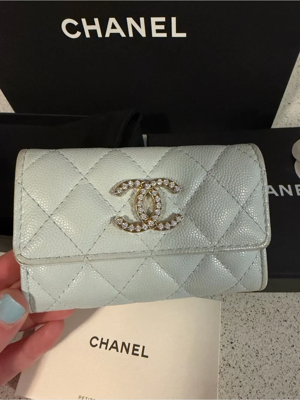 Chanel shiny caviar quilted crystal CC flap card holder light blue